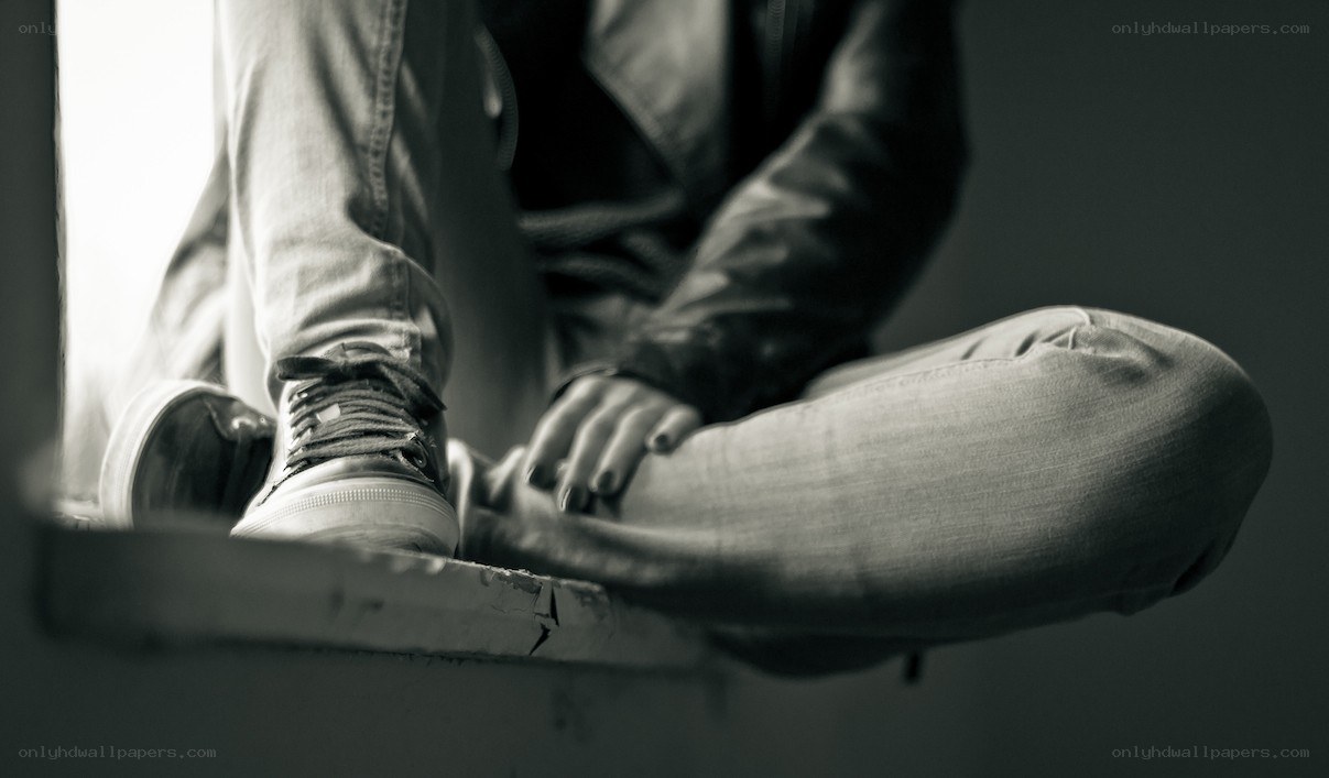 person sitting on a windowsill