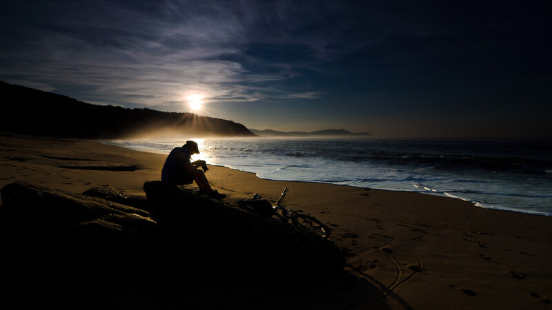 Person Sitting on Beach — Black