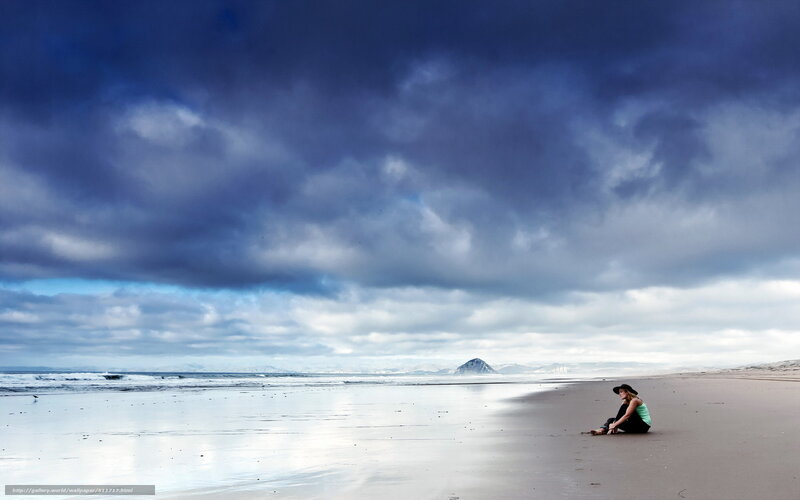 Person Sitting on Beach — Blue, Dramatic, Afternoon, Photograph, Clouds