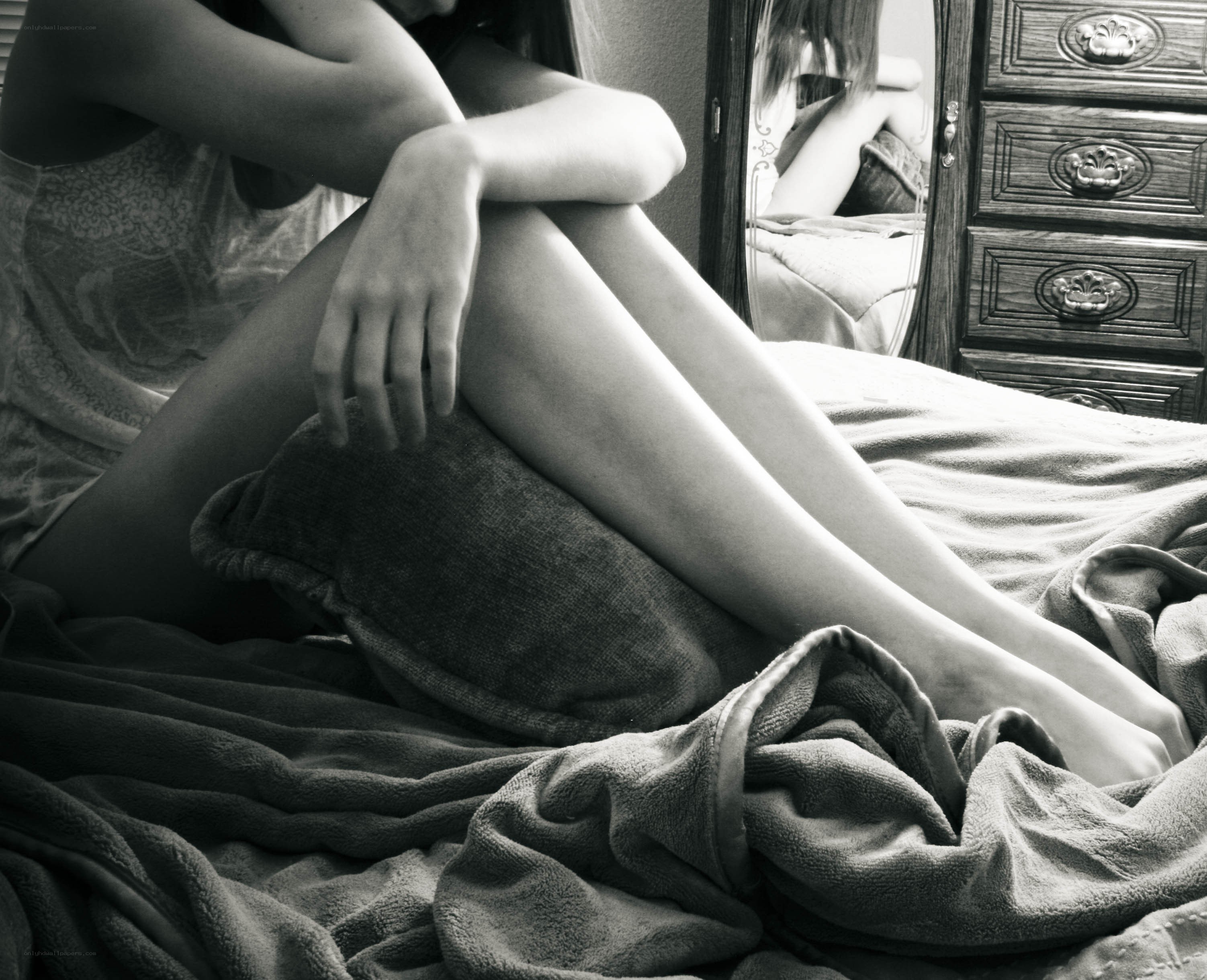 person sitting on bed