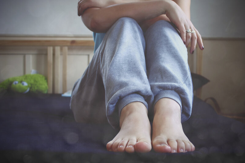 person sitting on bed