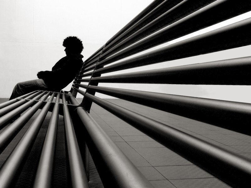 Person Sitting on Bench — Black, Dramatic, Photograph