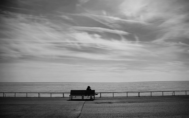 Person Sitting on Bench — Black
