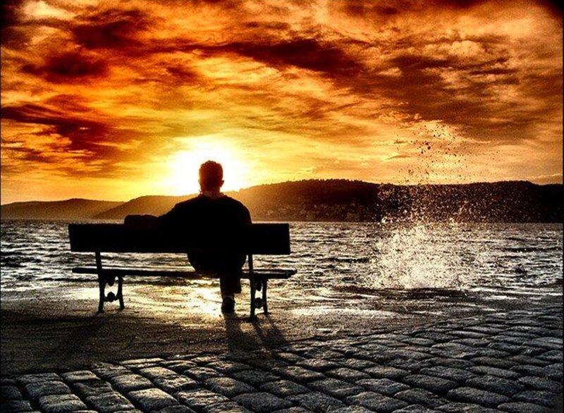Person Sitting on Bench — Orange