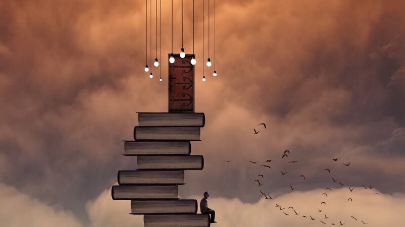 Person Sitting on Books