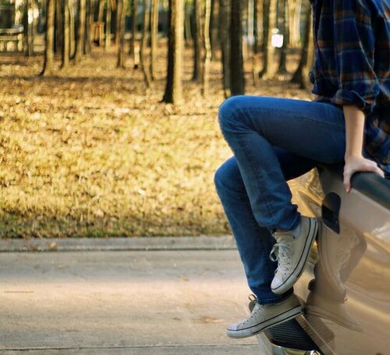 Person Sitting on Car