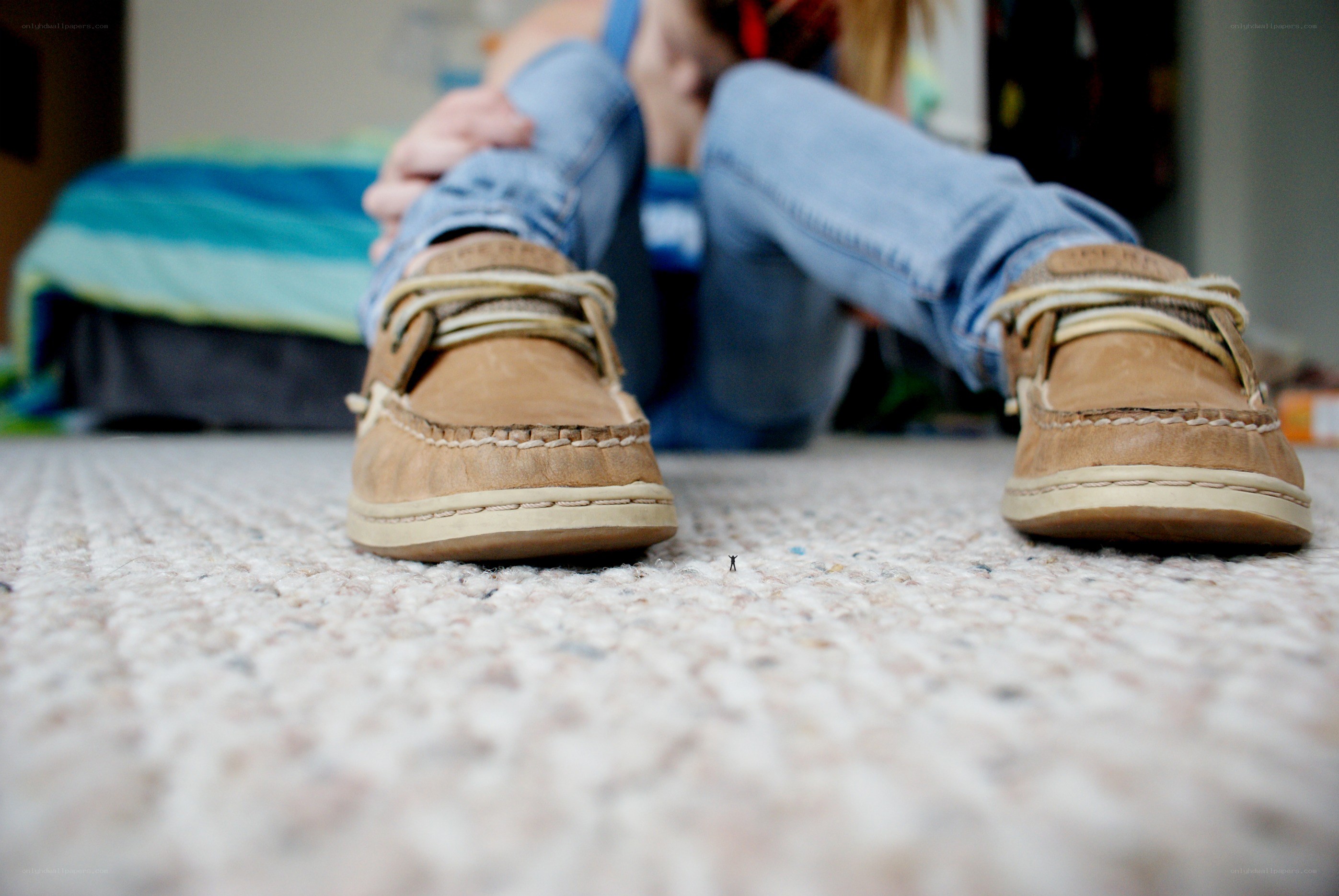 person sitting on carpet