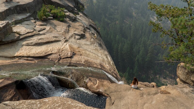 Person Sitting on Cliff — Brown, Serene
