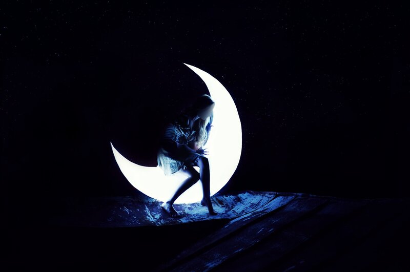 Person Sitting on Crescent Moon — Black