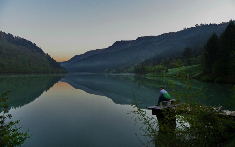 Person Sitting on Dock — Green