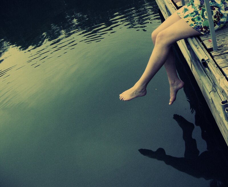 person sitting on dock