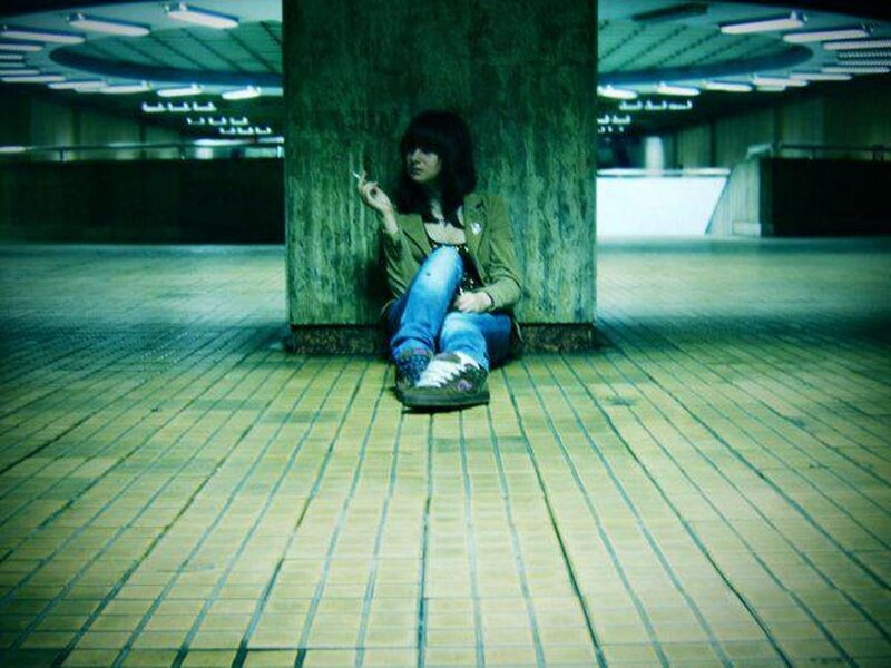 Person Sitting on Floor — Green