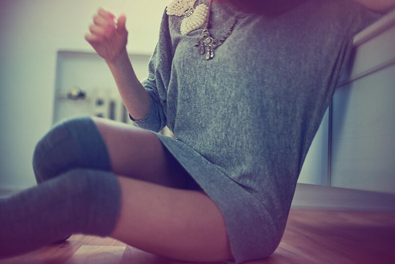 person sitting on floor in dress