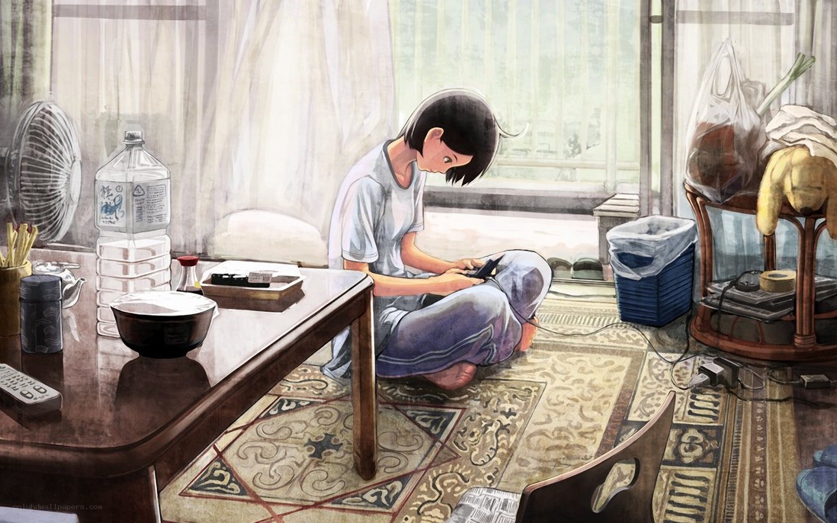 person sitting on floor using phone