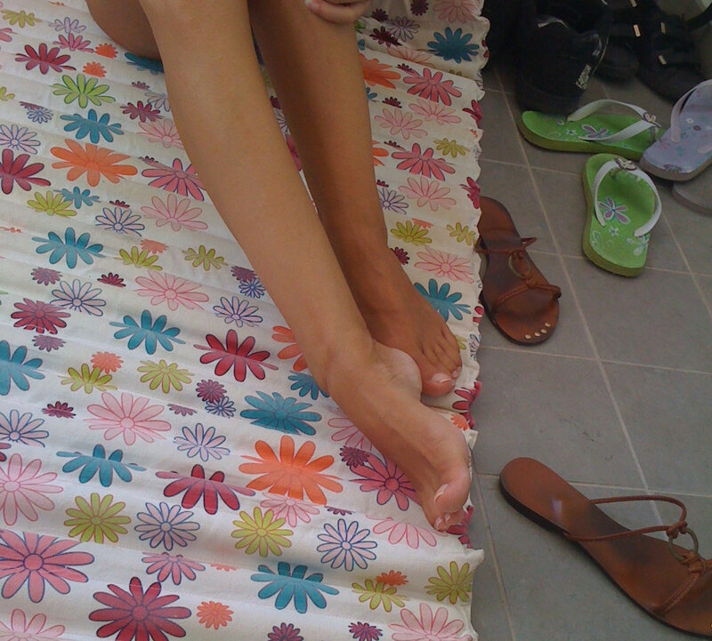 person sitting on floral mat