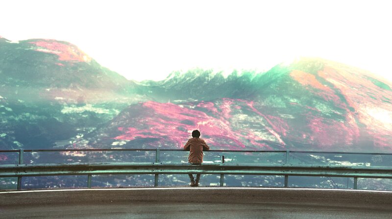 Person Sitting on Guardrail — Green