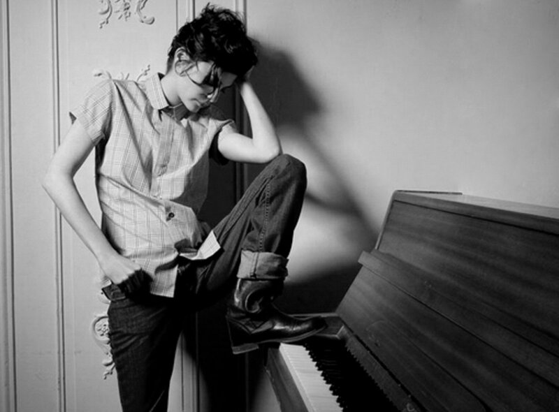 Person Sitting on Piano