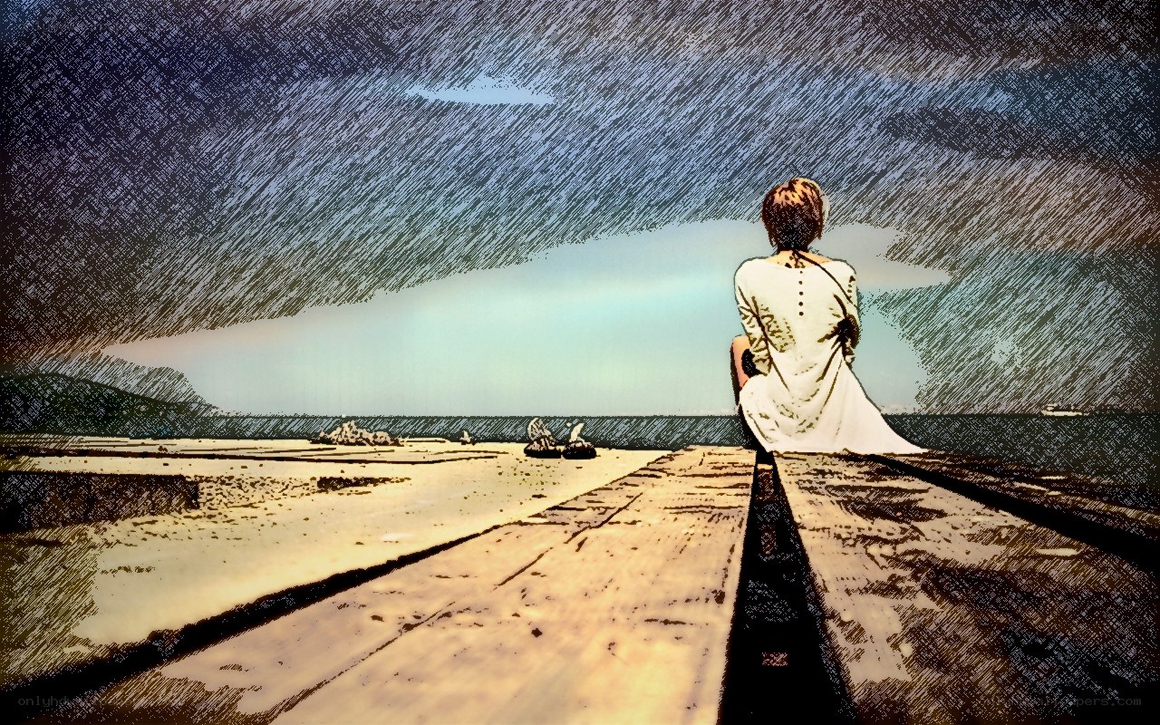 person sitting on pier at beach