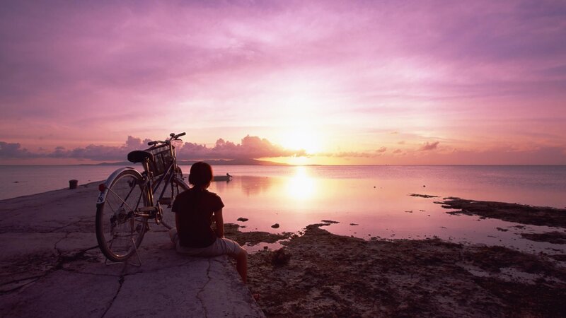 Person Sitting on Pier — Purple, Serene, Sunset, Photograph, Bicycle, Sea