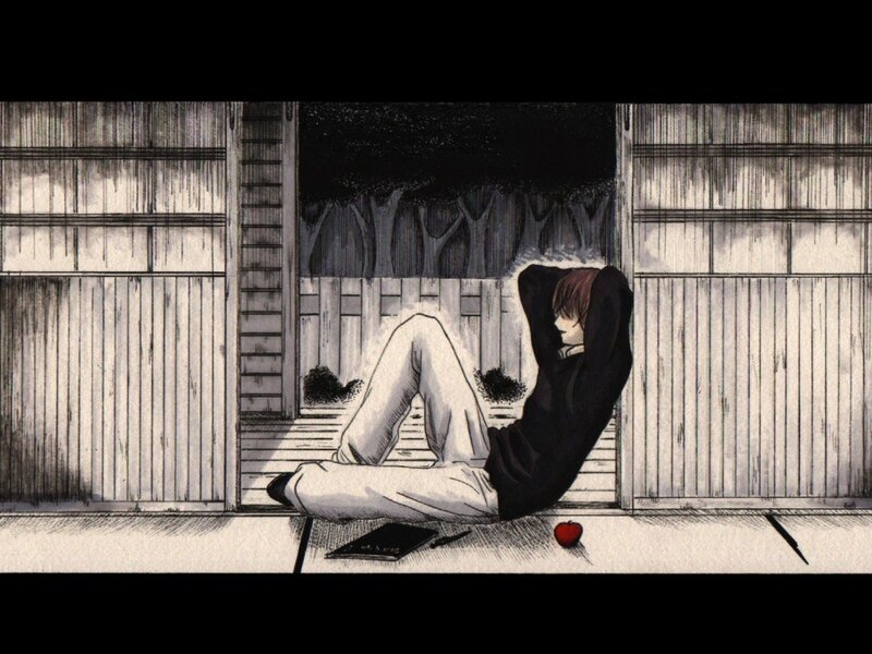 person sitting on porch at night