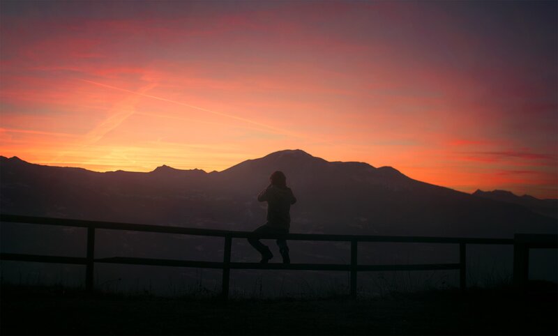 Person Sitting on Railing — Orange