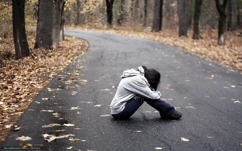 Person Sitting on Road — Gray
