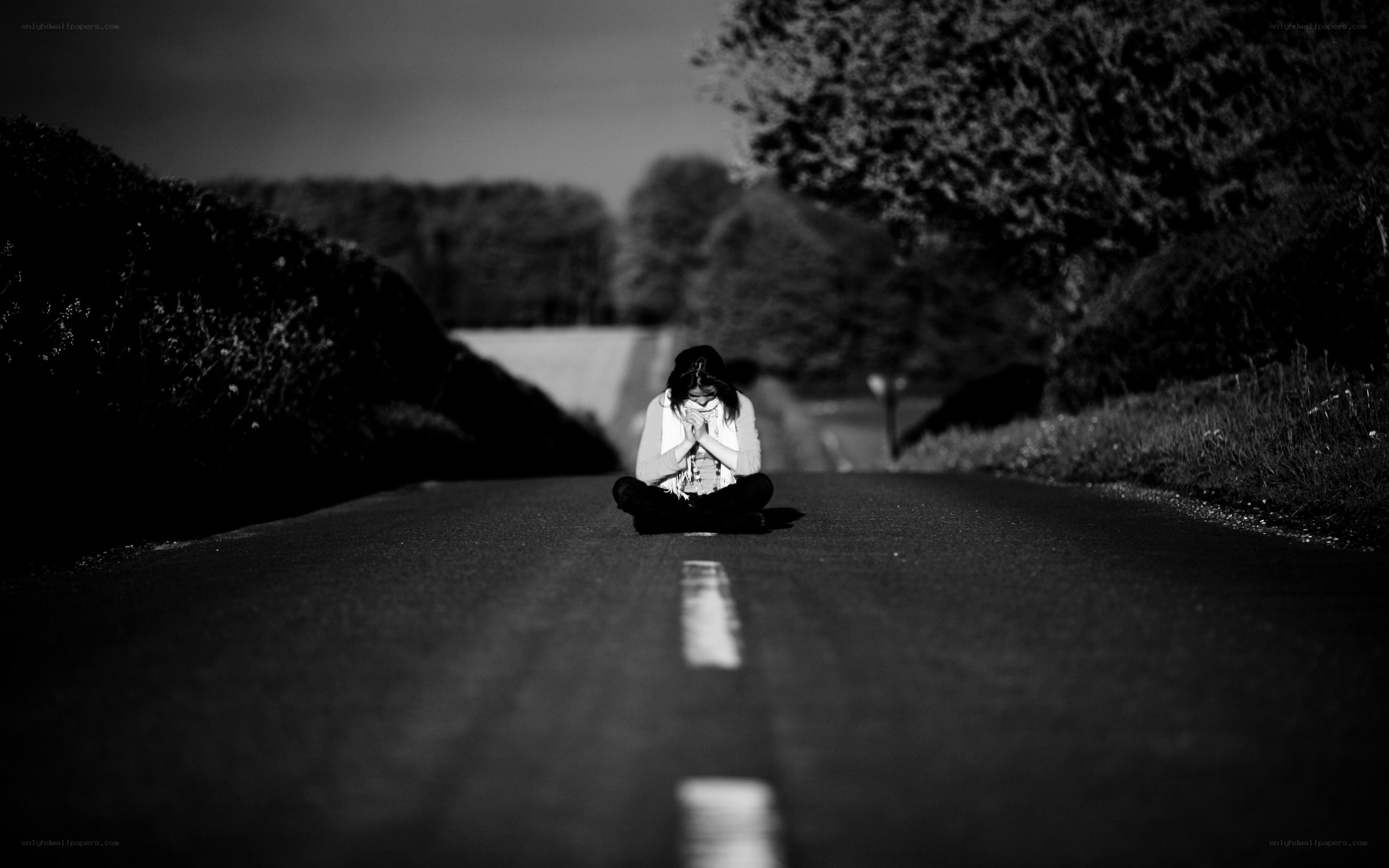 person sitting on road