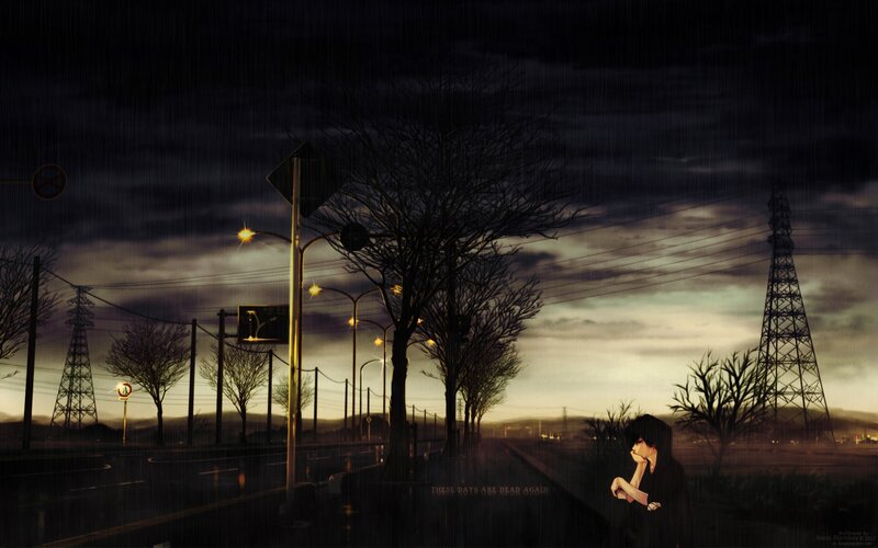 Person Sitting on Roadside