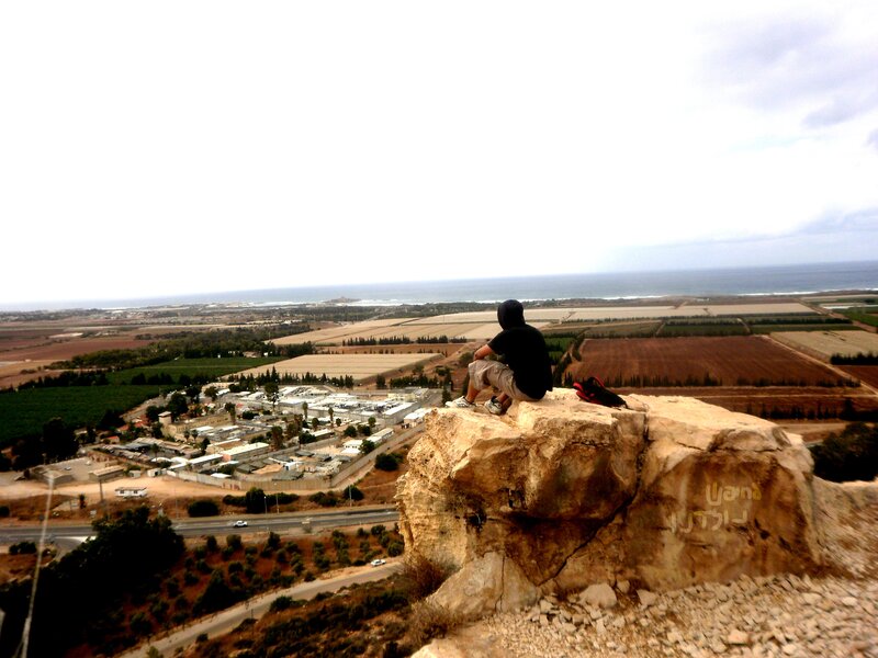 Person Sitting on Rock — Brown, Serene