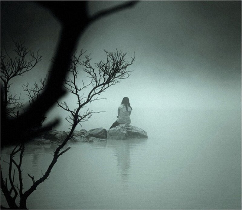 Person Sitting on Rock — Gray