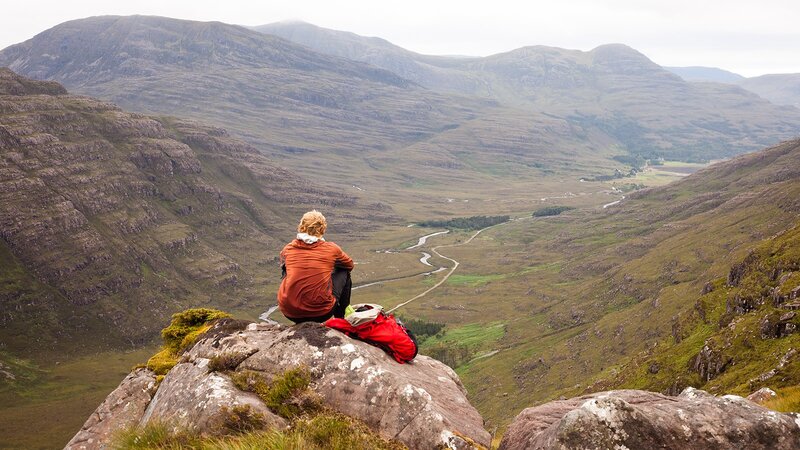 Person Sitting on Rock — Green, Serene