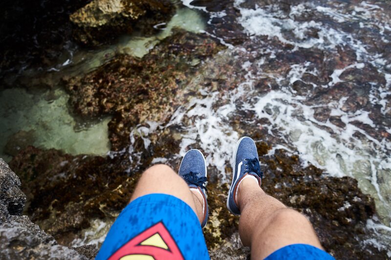 Person Sitting on Rocks — Blue, Calm