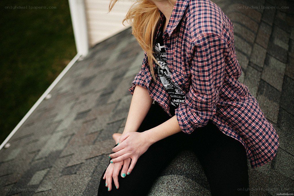 person sitting on roof