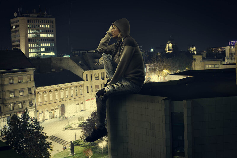 Person Sitting on Rooftop — Black, Dramatic
