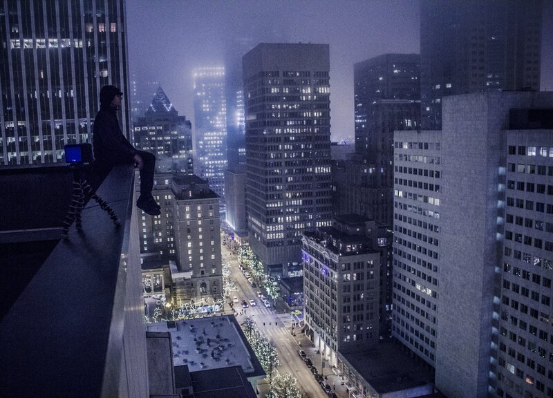 Person Sitting on Rooftop — Blue
