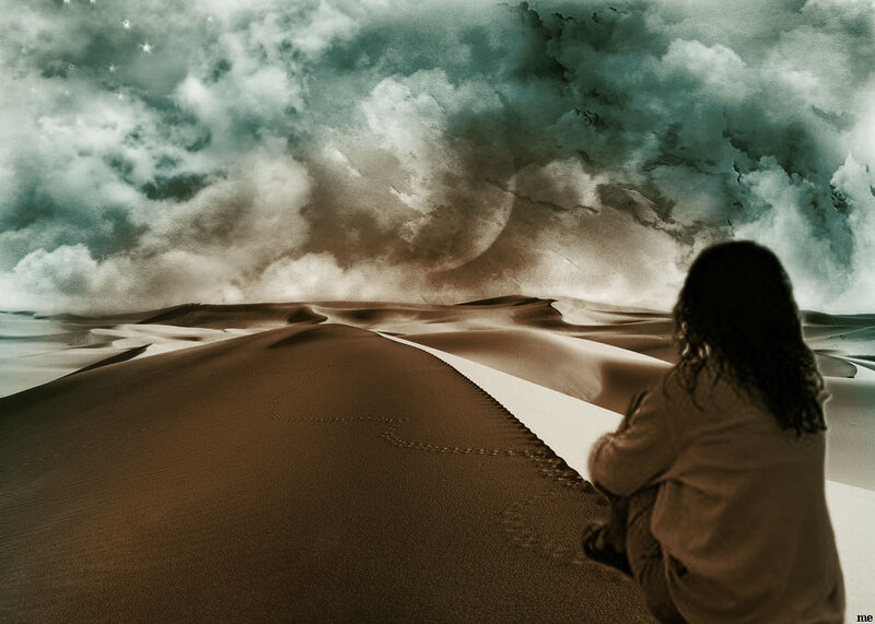Person Sitting on Sand Dune