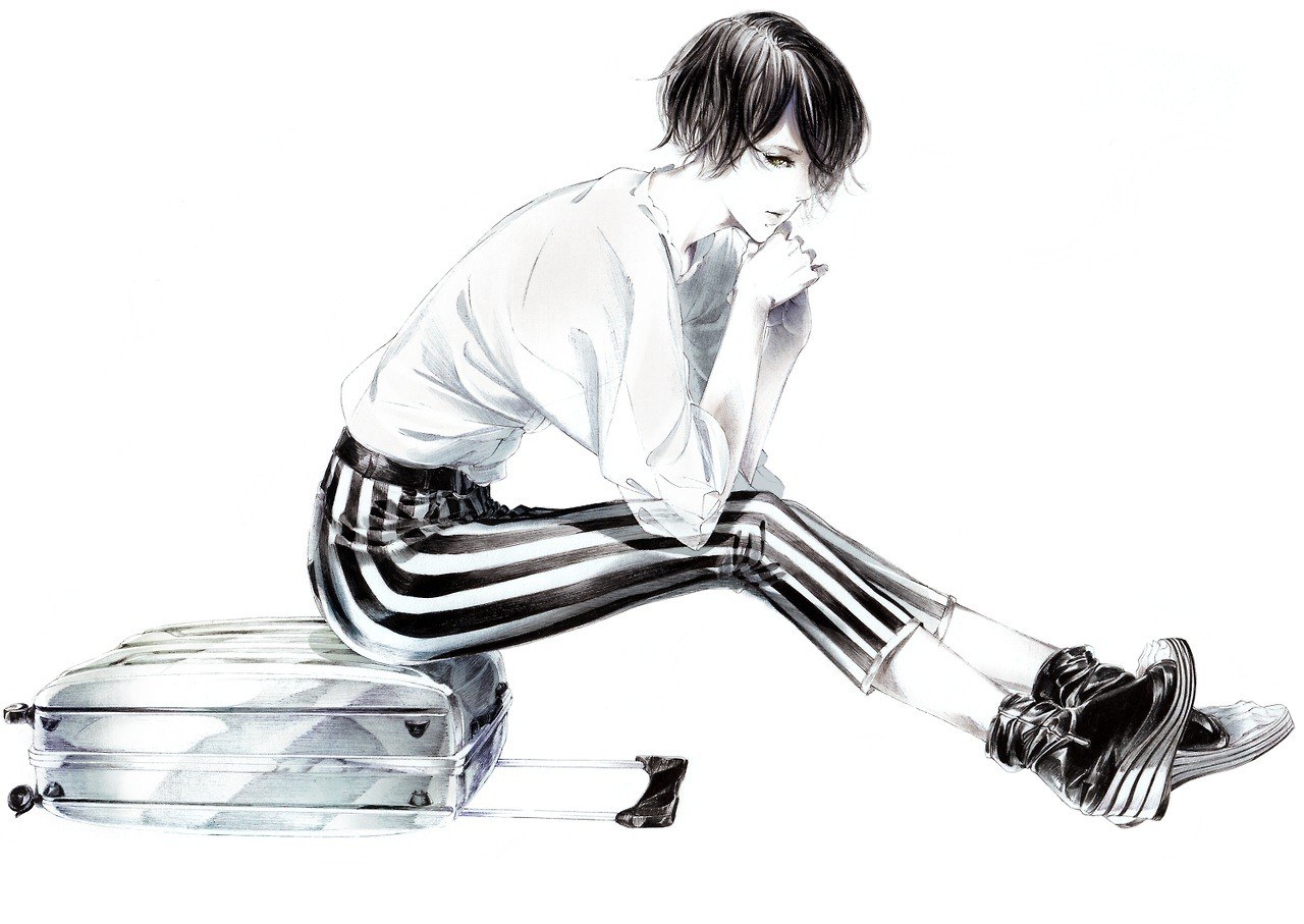 person sitting on suitcase