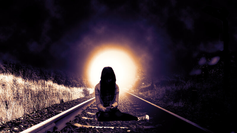 Person Sitting on Train Tracks — Black
