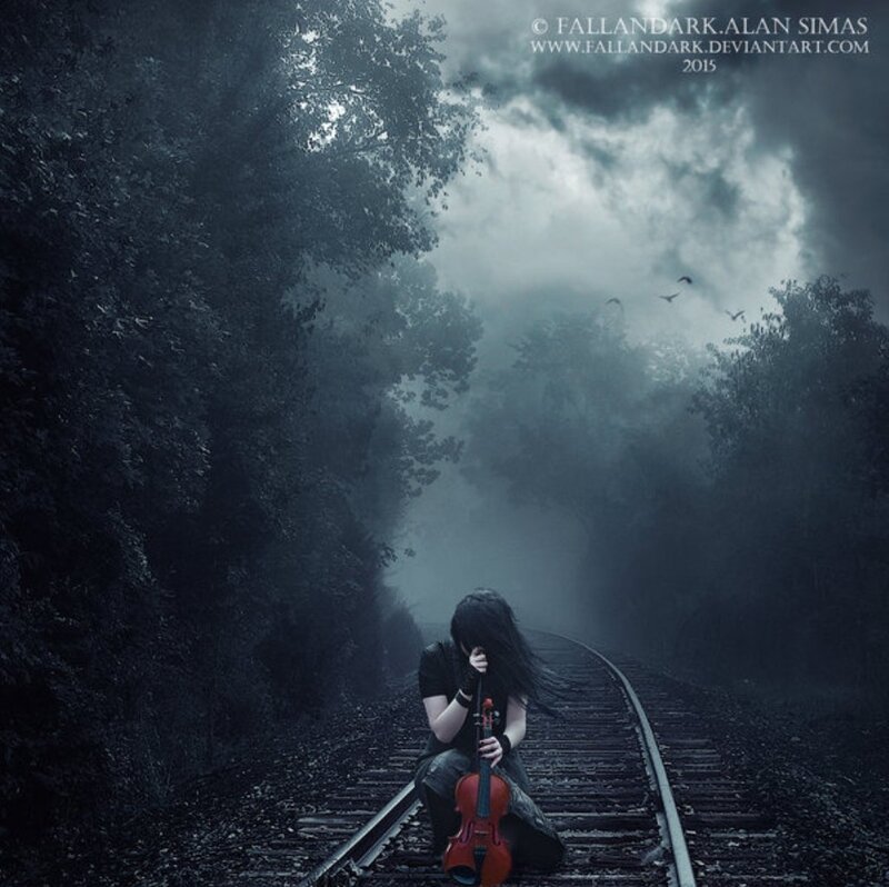Person Sitting on Train Tracks — Blue