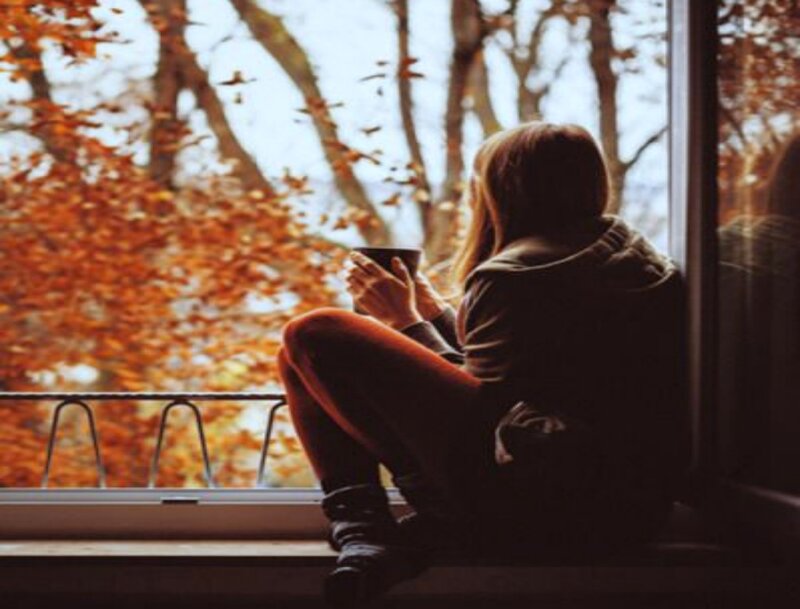 Person Sitting on Windowsill — Orange