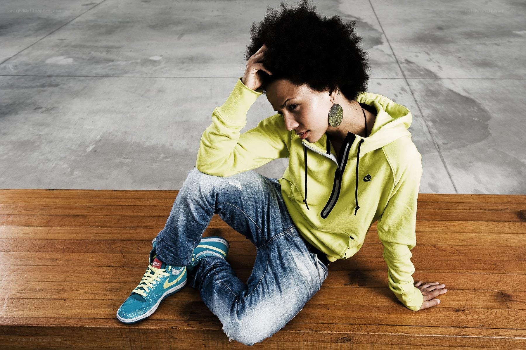 person sitting on wooden bench