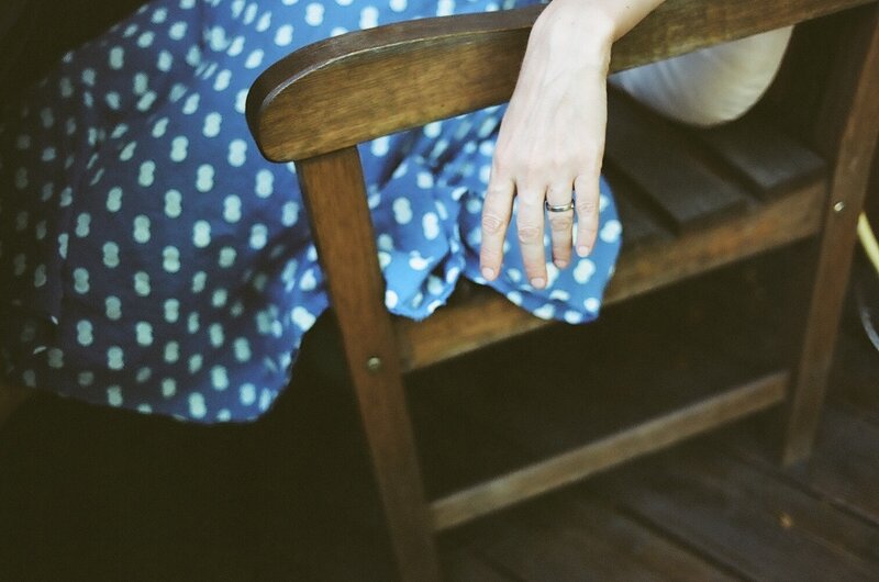 person sitting on wooden chair