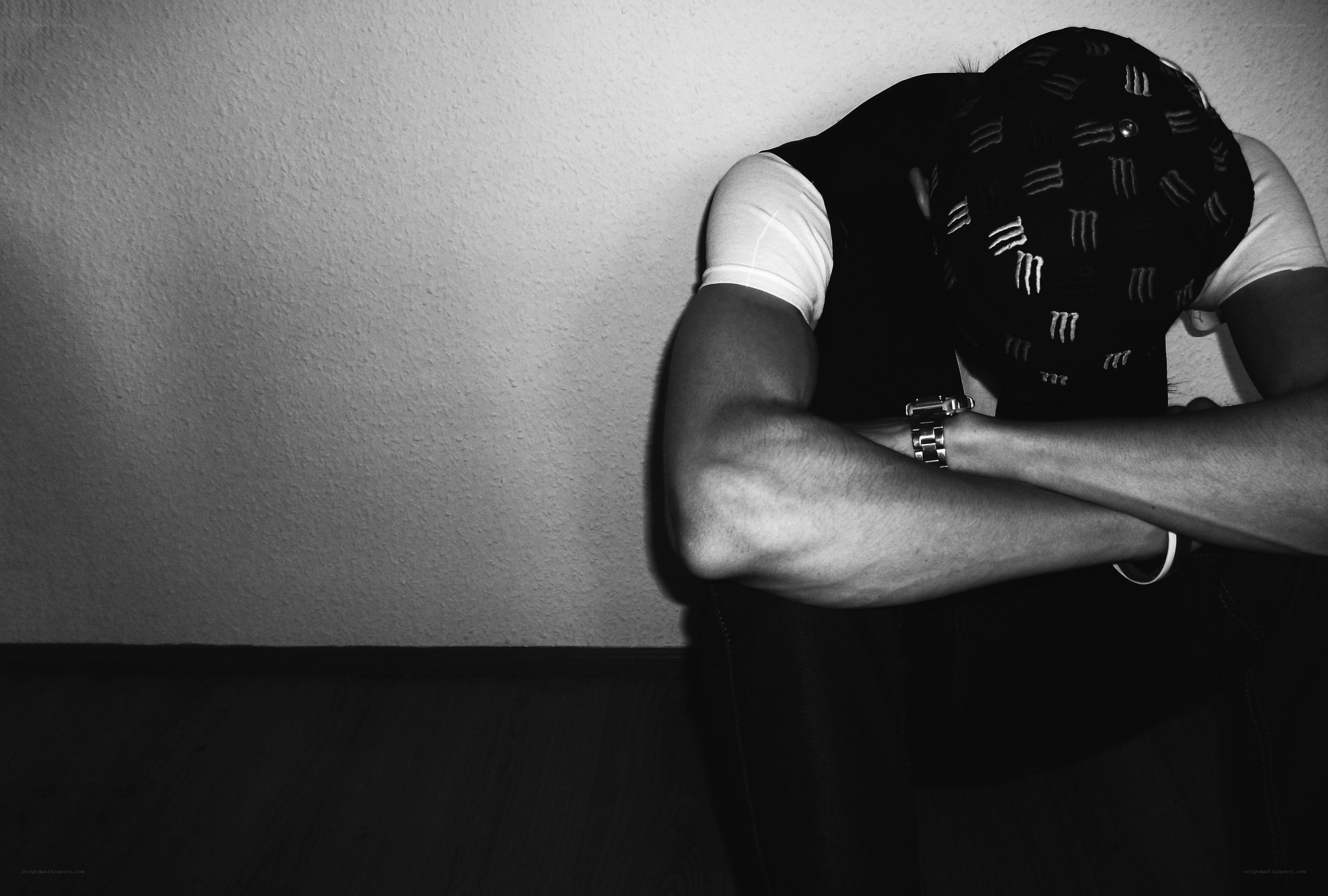 person sitting with head down