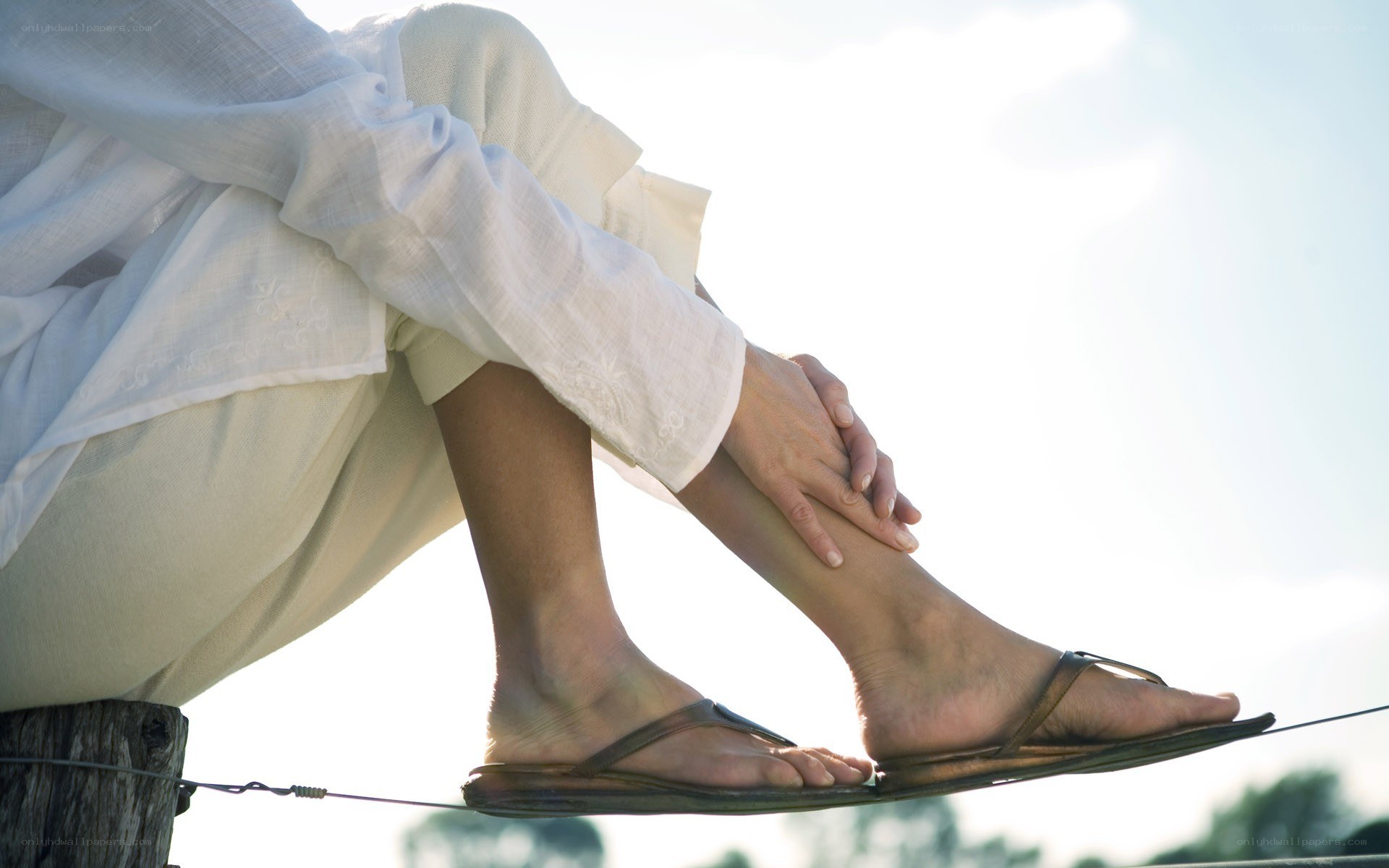 person sitting with legs crossed