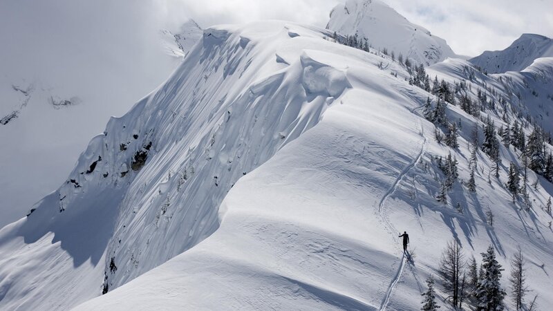 Person Skiing on Mountain — White