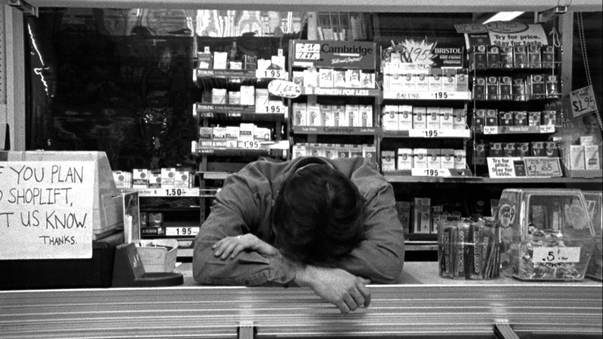 Person sleeping at store counter