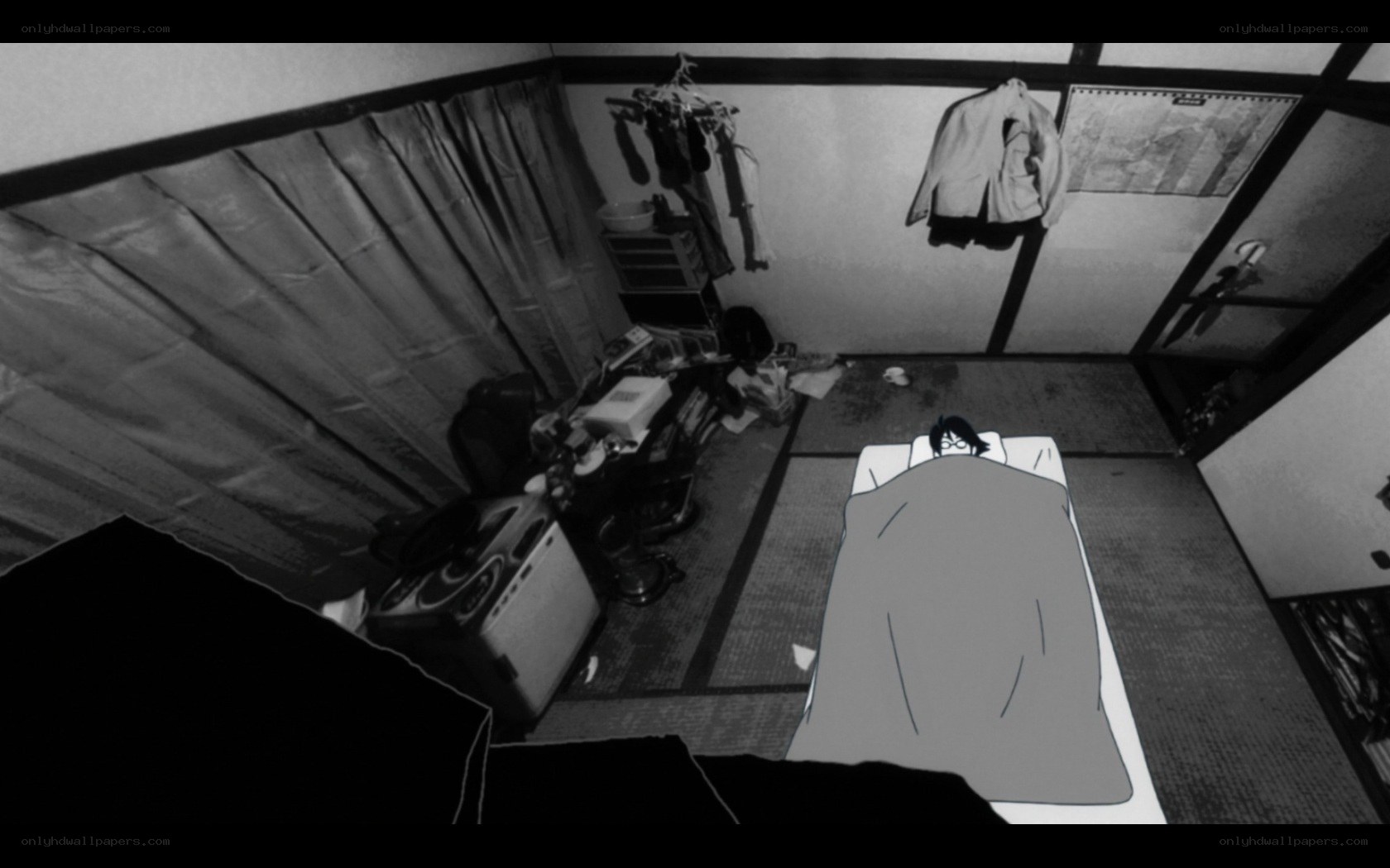person sleeping in cluttered room