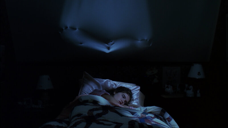 person sleeping in dark room