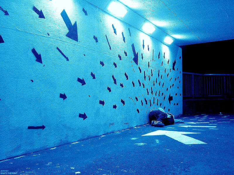 Person sleeping in tunnel