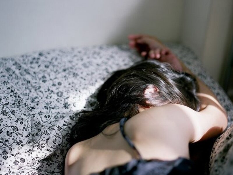 person sleeping on bed